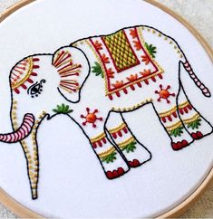 an embroidered elephant is shown in the hoop