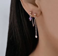 This rose gold chain earring has 2 stud earrings connected by a dangly chain. There is a CZ charm on the one stud. The other has a crystal birthstone. The earring is made of sterling silver 925 that is rose gold plated. This is one earring not a pair of earrings. Connected Ear Piercing, Chain Earings Piercings, 2 Lobe Piercing Earing Chain, Earrings For Double Piercings, Double Chain Earring, Double Ear Piercing Chain, Double Earings Piercings Chain, Double Piercing Chain, Double Pierced Earrings