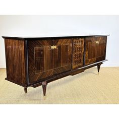 an art deco sideboard with two doors and three drawers