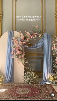 an entrance decorated with pink flowers and blue drapes for a private engagement ceremony at the ritz