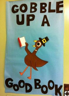 a bulletin board that says gobble up a good book on the front door with an ostrich holding a flag