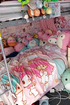 a bed with many stuffed animals on it in a room filled with other stuff toys