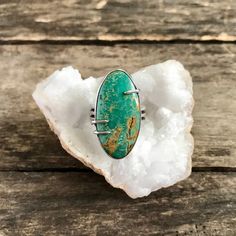 This handmade sterling silver ring features a natural, high grade Turquoise Mountain stone in a smooth bezel with prong details, along a wide, comfortable band. The stone is a beautiful, green color, mined here in the USA. The setting is entirely handmade, crafted of fine silver (.999) and sterling silver (.925) and has been oxidized to highlight the fine details and then polished to a high shine. Face of ring measures 1 1/4"tall x 5/8" wide. Ring is a US size 7.5 and cannot be resized. Please n Silver Smithing, Turquoise Statement Ring, Estilo Hippy, Jewelry Styles, Estilo Hippie, Handmade Sterling Silver Rings, Closet Update, Precious Jewels