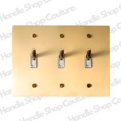 two light switch plates are shown in gold