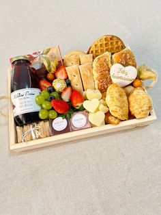 a wooden tray filled with different types of food