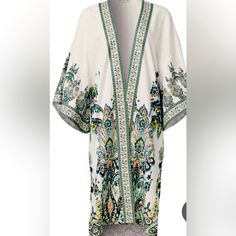 Thrown Over The Top Of Any Outfit, This Paisley-Printed Kimono Is An Extra-Breezy Layering Piece. Wide Bell Sleeves Balance The Longer-In-Back Hem While Side Slits Turn Up The Floaty Factor. Linen Fabrication Keeps It Lightweight Assuring There's No Look You Can't Elevate With This Feminine Topper! Sizes: S/M Fabric Does Not Have Stretch Viscose/Cotton/Linen. Brand New Condition White V-neck Kimono For Festival, Casual White Kimono For Festival, White Kimono With Boho Print, Casual Printed White Kimono, Casual White Printed Kimono, White Cotton Kimono With Floral Print, White Floral Print Kimono For Festival, Casual White Floral Print Kimono, White Floral Kimono For Festival