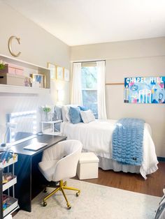 a bedroom with a bed, desk and chair in it's centerpieces