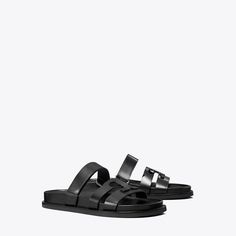 Minimal and effortless, our Ines Sport slide is updated with sharp lines featuring a split take on our signature Double T. A velcro strap secures the foot and an ergonomic footbed — cupped by a rubber sole — adds supreme comfort. Modern Leather Slides With Double Strap, Modern Slides With Leather Footbed And Single Toe Strap, Modern Slides With Single Toe Strap And Leather Footbed, Modern Double Strap Leather Slides, Modern Leather Double Strap Slides, Modern Double Strap Slides With Cushioned Footbed, Modern Slides With Double Strap And Removable Insole, Modern Slides With Removable Insole And Double Strap, Modern Double Strap Sandals With Rubber Sole