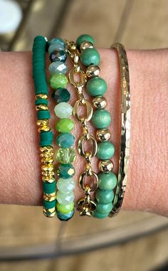 Consists of 5 bracelets "Turn your green dreams into reality with our Green Come True Bracelet Stack. This stack features a stunning shade of green, adding a pop of color to any outfit. Get ready to make a statement and stand out from the crowd. Gold cuff- (one size…if require smaller or larger contact us first so we can suggest an alternate bracelet) Roma Chain Bracelet (one size…if require smaller or larger contact us first so we can suggest an alternate bracelet) Forest Green HEISHI (one size Stackable Green Beaded Bracelets, Trendy Green Stackable Jewelry, Trendy Green Stretch Bracelet Stackable, Trendy Green Stackable Stretch Bracelet, Elegant Green Adjustable Stretch Bracelet, Green Adjustable Bangle Stretch Bracelet, Green Stackable Bracelets For Gift, Green Stackable Bracelets Gift, Green Stretch Bangle Bracelet