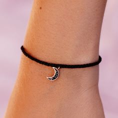 An important symbol in ancient cultures, the crescent moon represents new beginnings and optimism. The Dark Moon Charm Bracelet features a rose gold crescent moon pendant encrusted with Hematite stones on a black bitty braid. - Charm: Brass base with rose gold plating- Crescent Moon Charm: 9mm (H)- Wax-coated bracelet- Adjustable from approximately 2-5 inches in diameter- Because jewelry products are handcrafted by artisans, dimensions may vary from piece to piece Adjustable Crescent Rose Gold Jewelry, Black Adjustable Crescent Jewelry, Gold Crescent Moon, Pura Vida Bracelets, Crescent Moon Pendant, Hematite Stone, Dark Moon, Moon Charm, Rose Gold Bracelet