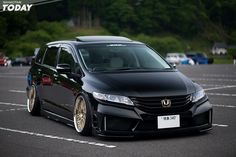 a black car parked in a parking lot