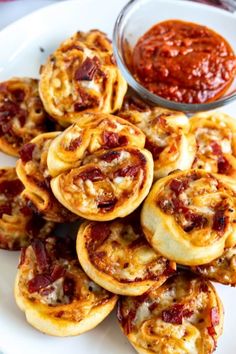 small pastries on a white plate with sauce