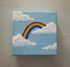 a painting of a rainbow in the sky with clouds on it's sides,