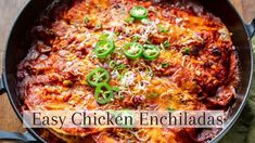 an easy chicken enchiladas recipe in a skillet on a wooden table