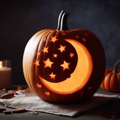 a pumpkin carved to look like the moon and stars