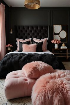 a black and pink bedroom with fur pillows