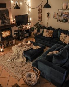 a living room filled with lots of furniture next to a fire place in a fireplace