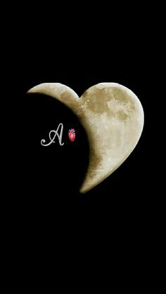 a heart shaped moon with the letter a on it's side and a ladybug in the middle