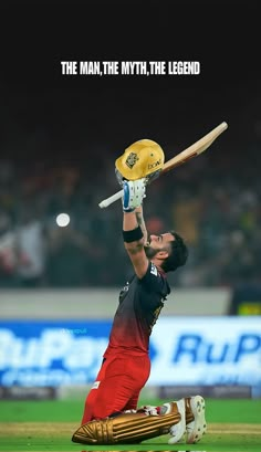 a man holding a bat in the air on top of a field