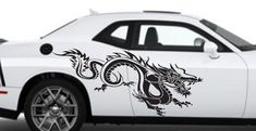 a white car with a dragon decal on it