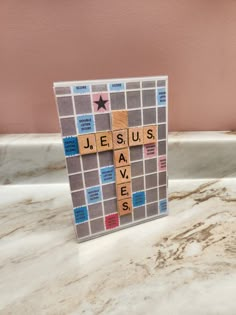 Craft was made using an acrylic 5x7 frame, photocopy of a Scrabble board (cut to 5x7), photocopies of Scrabble tiles and tan colored craft foam. Board Game Themed Crafts, Life Way Vbs 2023, Scrabble Tile Crafts Games, Scrabble Vbs Decorations