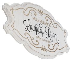 a wooden sign that says self service laundry room on it's front and side