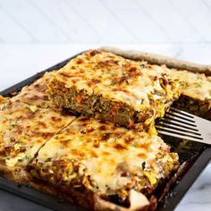 a close up of food on a pan with a fork