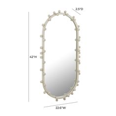 a white mirror with balls on it and measurements for the frame, shown from the side