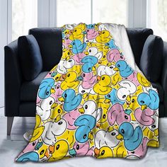 an elephant and ducky blanket on a couch