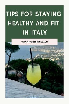 Tips for staying healthy and fit in Italy, with a view of a cocktail and a scenic coastal landscape. Trip To Italy