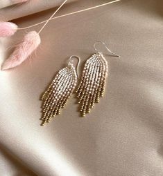 These fringe ombre  beaded earrings are made of high quality Czech beads. Colors: beige, dusty pink, gold--------------------------------------------✦ The Details:✔ Made with quality Czech beads✔ Made using strong bead weaving thread. ✔ Lenght: app. 2 inches✔ Sterling silver earrings hooksThere may be some color discrepancies which is due to the different monitor settings✦ All  earrings hooks are nickel and lead free!✦ More great boho earrings found here https://www.etsy.com/shop/LiliBeadShopFol Handwoven Earrings, Boho Wedding Earrings, Beads Colors, Ombre Earrings, Dangle Earrings Boho, Boho Style Earrings, Gold Dangle Earrings, Earrings Diy, Beaded Dangle Earrings