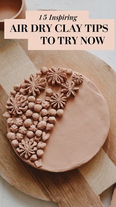 a cake with flowers on it sitting on top of a wooden cutting board