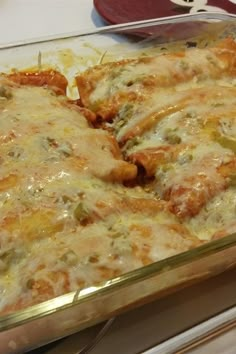 a casserole dish with cheese and meat in it