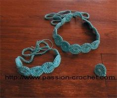 two crocheted bracelets on a wooden table