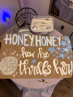 a sign that says honey honey how the trufls roll on top of a table