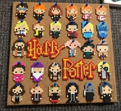 a cork board with some pixelated characters on it