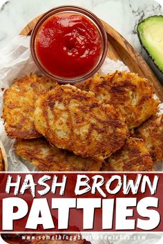 hash browns patties with ketchup and avocado on a cutting board