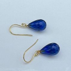 This listing is for: Gold  925 sterling Silver Royal Blue sapphire quartz drop Earrings, Royal blue sapphire quartz Drop Earrings, Jewelry Gift For Her.   Blue sapphire quartz drop shaped Drops are attached to 925 Sterling Silver Gold  Gemstone : Blue sapphire quartz  Gemstone Size : Approx. 15X10 mm type of gemstone :  Blue sapphire quartz    Material : 925 Sterling Silver, Gold Plated Check out the other sparkly color options for more fun: https://www.etsy.com/shop/BeautyOfImagination?ref=shop Blue Gemstone Teardrop Earrings For Formal Events, Classic Sapphire Drop Jewelry, Teardrop Sapphire Earrings For Gift, Blue Drop Earrings With Ethical Gemstones, Sapphire Teardrop Gemstone Earrings, Sapphire Briolette Gemstone Earrings, Blue Gemstone Teardrop Earrings, Blue Briolette Teardrop Earrings For Gift, Hypoallergenic Blue Briolette Earrings