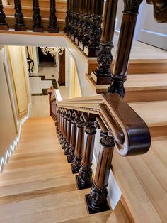 a staircase with wooden handrails and wood balconies