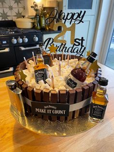 a birthday cake with liquor and marshmallows on it