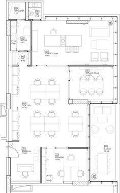 the floor plan for an office with two desks and three couches in it