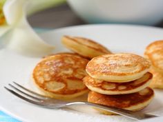 some pancakes on a plate with a fork