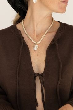 Discover elegance and modernity with our Satin Rope Baroque Pearl Necklace. This necklace showcases a satin rope with an elegant design, accompanied by a stunning pearl for an added touch of sophistication. Perfect for any event, modern and refined. 16" rope with a 2" extender Genuine baroque pearl, satin rope Each baroque pearl shape and color may vary due to the characteristics of natural materials Lead and Nickel free Made in China Elegant Silk Cord Necklace For Gift, Elegant Adjustable Beige Necklace, Baroque Pearl Necklace, Beauty Sale, Baroque Pearls, Vintage Shoes, Clothes Gift, Holiday Outfits, Hair Jewelry