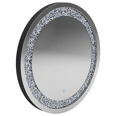 a round mirror with silver glitter on it