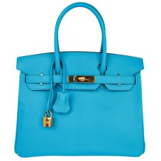 Mightychic offers an Hermes Birkin 30 bag featured in coveted Blue Aztec. This stunning rare colour is considered to be among the most gorgeous of all Hermes Blue hues. Chevre leather accentuates the beauty of Hermes colours. Lush with gold hardware. Plastic still on hardware. This Hermes Birkin bag is divine colour for year round wear. Comes with the lock and keys in the clochette and sleepers. Private and discrete consignment services offered. final sale Private and discrete consignment servic Luxury Blue Top Handle Bag, Luxury Blue Bag For Everyday Use, Luxury Blue Shoulder Bag, Luxury Blue Tote Shoulder Bag, Luxury Blue Top Handle Satchel, Luxury Blue Shoulder Bag For Daily Use, Luxury Blue Shoulder Bag For Shopping, Luxury Turquoise Top Handle Bag, Luxury Blue Bag With Detachable Strap