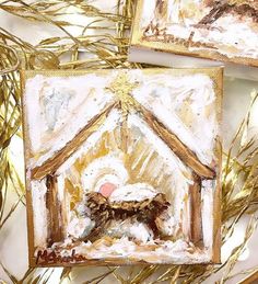 two paintings depicting the birth of jesus and baby jesus in a manger with gold foil