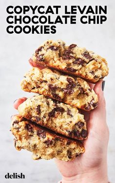 a hand holding three cookies in front of the words copycat leviian chocolate chip cookies