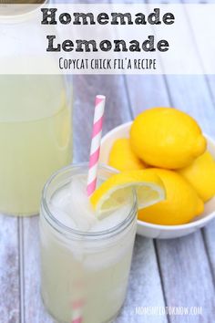 homemade lemonade in a glass next to some lemons