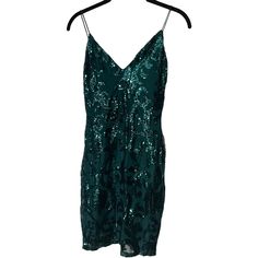 Lovely Lady Homecoming Semi-Formal Dress Nwt Features A Sleeveless V-Neckline, Bungee Spaghetti Straps, And A Short, Form-Hugging Silhouette. The Sheer Mesh Fabric Includes A Full Knit Lining And Has A Chic All-Over Sequin Scroll Embroidered Design. Dark Green Size Medium 16” Pit-To-Pit 29” Long - 33” Including Shoulder Straps Shell: 98% Polyester 98% Polyester 2% Spandex 2% Elastane Lining: 100%Polyester 100% Polyester Homecoming, Prom, Semi-Formal, Dance, Going Out Hoco Short Dress, Formal Dance, Hugging Silhouette, Semi Formal Dress, Short Form, Sequin Shorts, Short Prom, Embroidered Design, Formal Dress