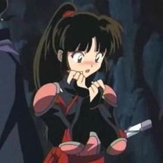 an anime character holding a knife in her hand